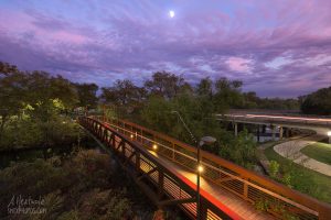 Dusk on the San Marcos River at the pedestrian bridge.