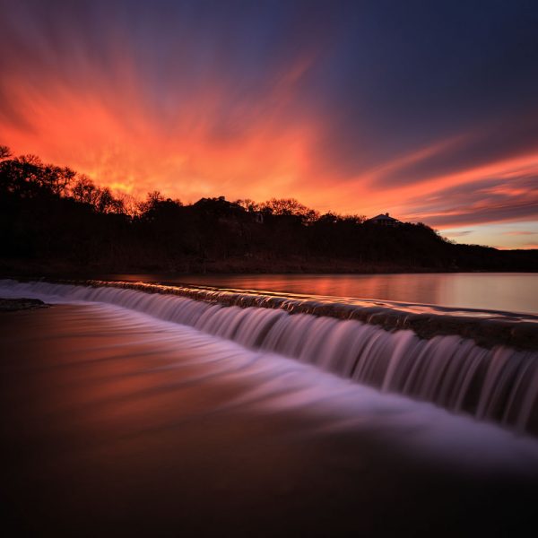 A fiery sunset on the Blanco River at 5 Mile Dam
