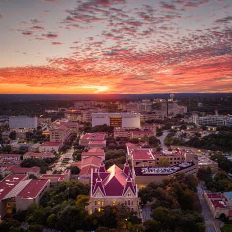Texas State University is bathed in the warm light of a beautiful Autumn Sunset.