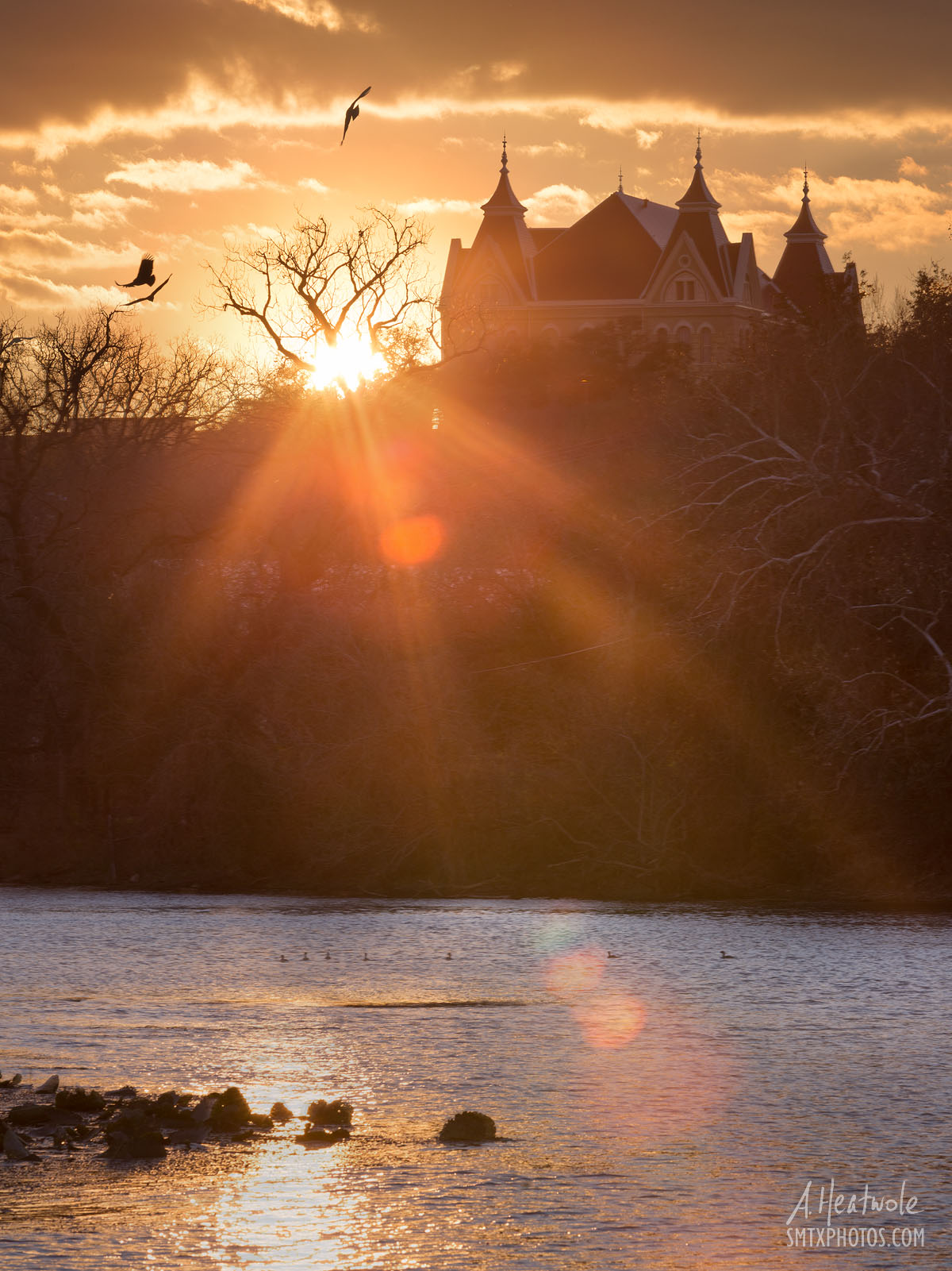 Sunset at Spring Lake and Old Main at Texas State University in San Marcos, TX.